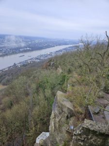 The craggy face of the rock, with the River Rhine in the background